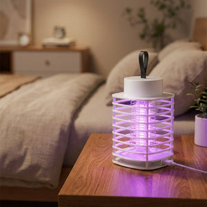 Lampe anti-moustiques USB lumière UV violette sur table de chevet