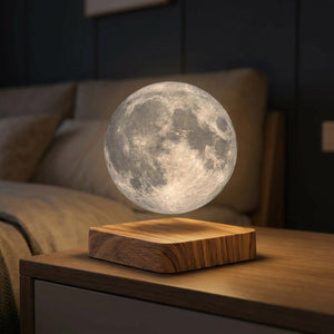 Lampe à lévitation magnétique avec lune 3D flottante allumée sur socle en bois dans une chambre
