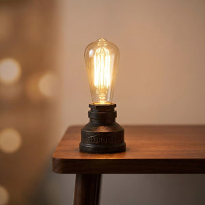 Lampe tuyau industrielle coloris bronze patiné allumée