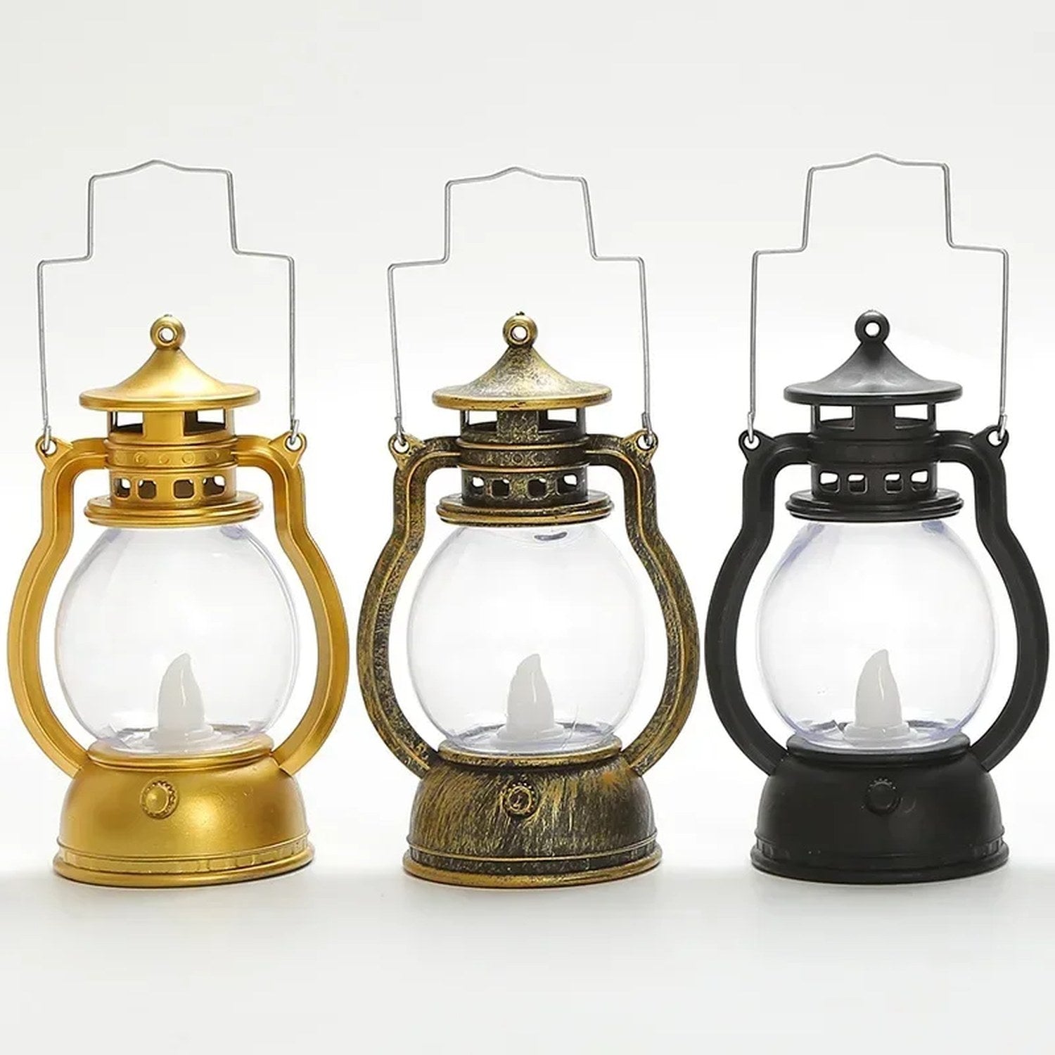 Trois lanternes LED rétro côte à côte en couleurs noir, doré et argenté