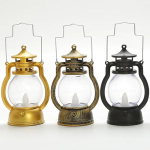 Trois lanternes LED rétro côte à côte en couleurs noir, doré et argenté