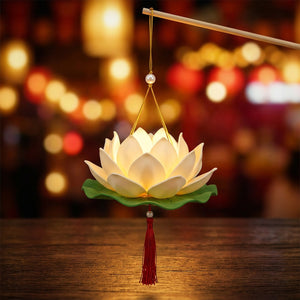 Lanterne fleur de lotus LED blanche allumée avec lueur dorée