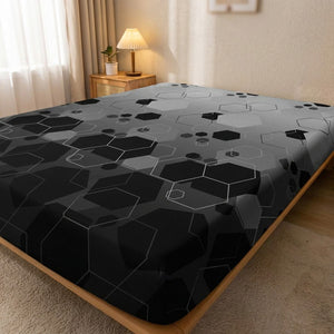Drap-housse hexagones sur un lit dans une chambre contemporaine avec lampe de chevet