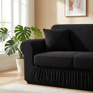 Détail de l'accoudoir et du coussin d'une housse de canapé noire