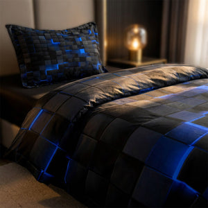 Gros plan sur le motif de cubes 3D bleus en relief de la parure de lit