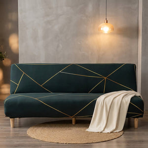 Housse de banquette vert foncé à lignes dorées dans un intérieur loft moderne avec plaid crème et suspension chaude