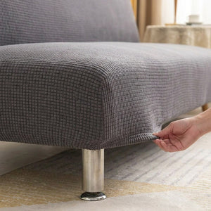 Détail du tissu jacquard tendu sans pli sur l'assise du canapé-lit