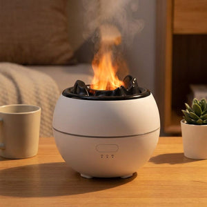 Diffuseur d'huile essentielle blanc a flamme sur un bureau avec tasse et plante
