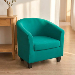 Housse de fauteuil club turquoise près d'une console d'entrée lumineuse