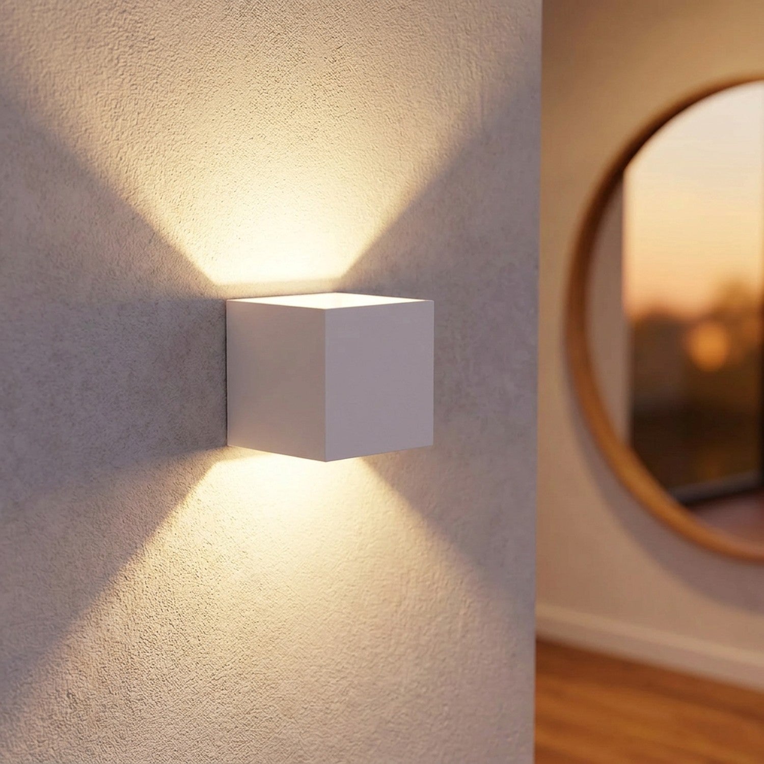 Applique murale LED blanche dans une entrée moderne près d'un miroir rond