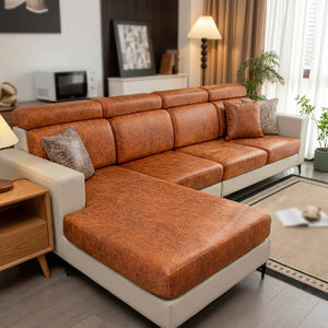 Housse de canapé orange cognac effet cuir installée sur un canapé d'angle