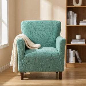 Housse de fauteuil club turquoise dans un coin bureau avec plaid
