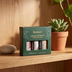 Coffret huiles essentielles aromatiques 3 pcs sur étagère bois avec plante