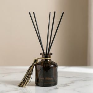 Diffuseur à roseaux parfumé - flacon ambré avec bâtons rotin