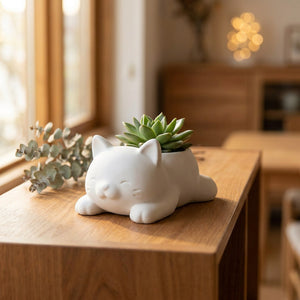 Cache-pot chat couché kawaii en plastique blanc avec succulente