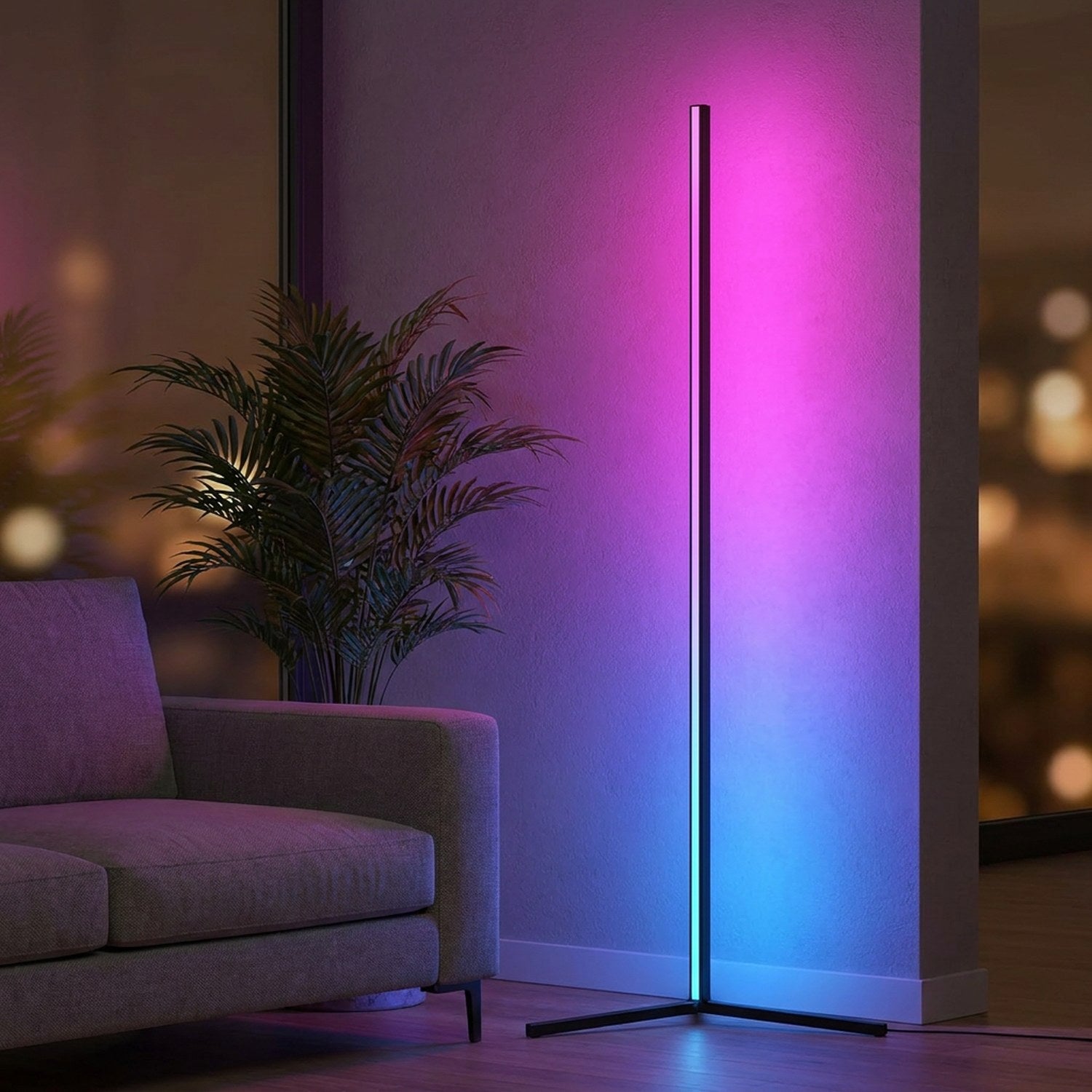 Lampadaire d angle LED RGB noir allumé en dégradé magenta et bleu dans un salon moderne