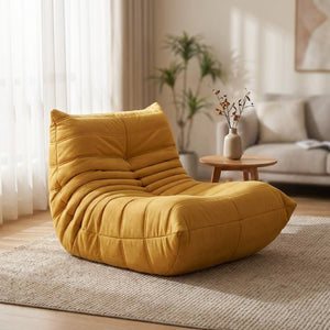 Pouf géant canapé de sol jaune moutarde en velours posé au sol