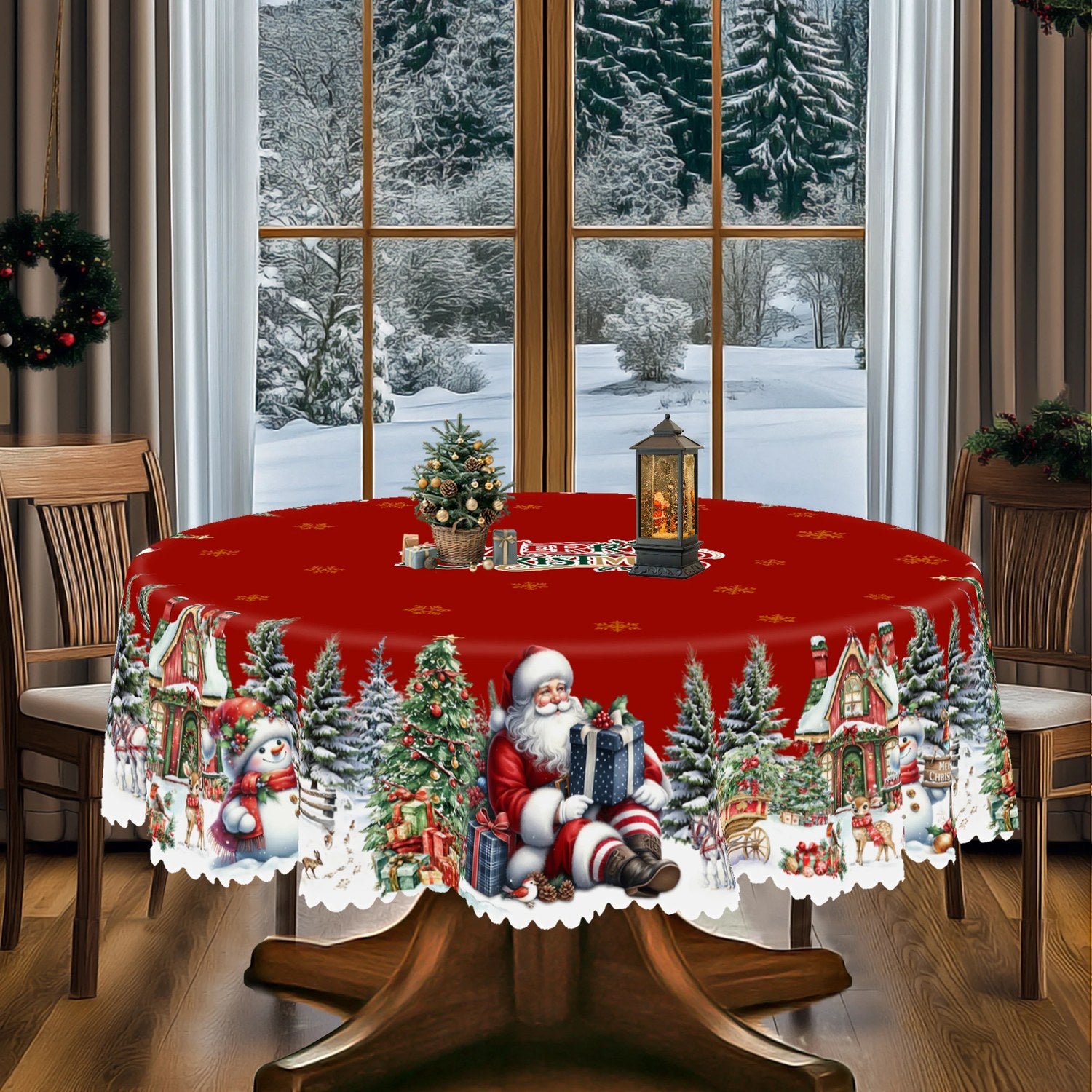 Nappe de Noël ronde rouge dépliée montrant le motif village enneigé et le bord en dentelle blanche