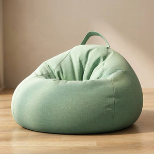 Pouf poire coloris vert sauge sur fond neutre chaleureux