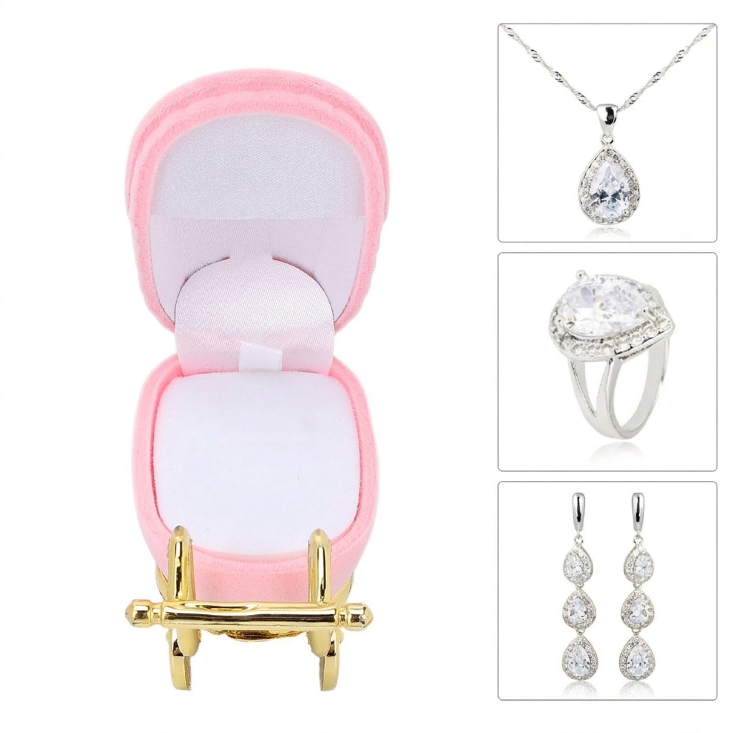 Intérieur en velours blanc du coffret landau rose à côté de bijoux argentés