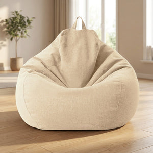 Pouf poire beige en coton et lin posé dans un salon chaleureux