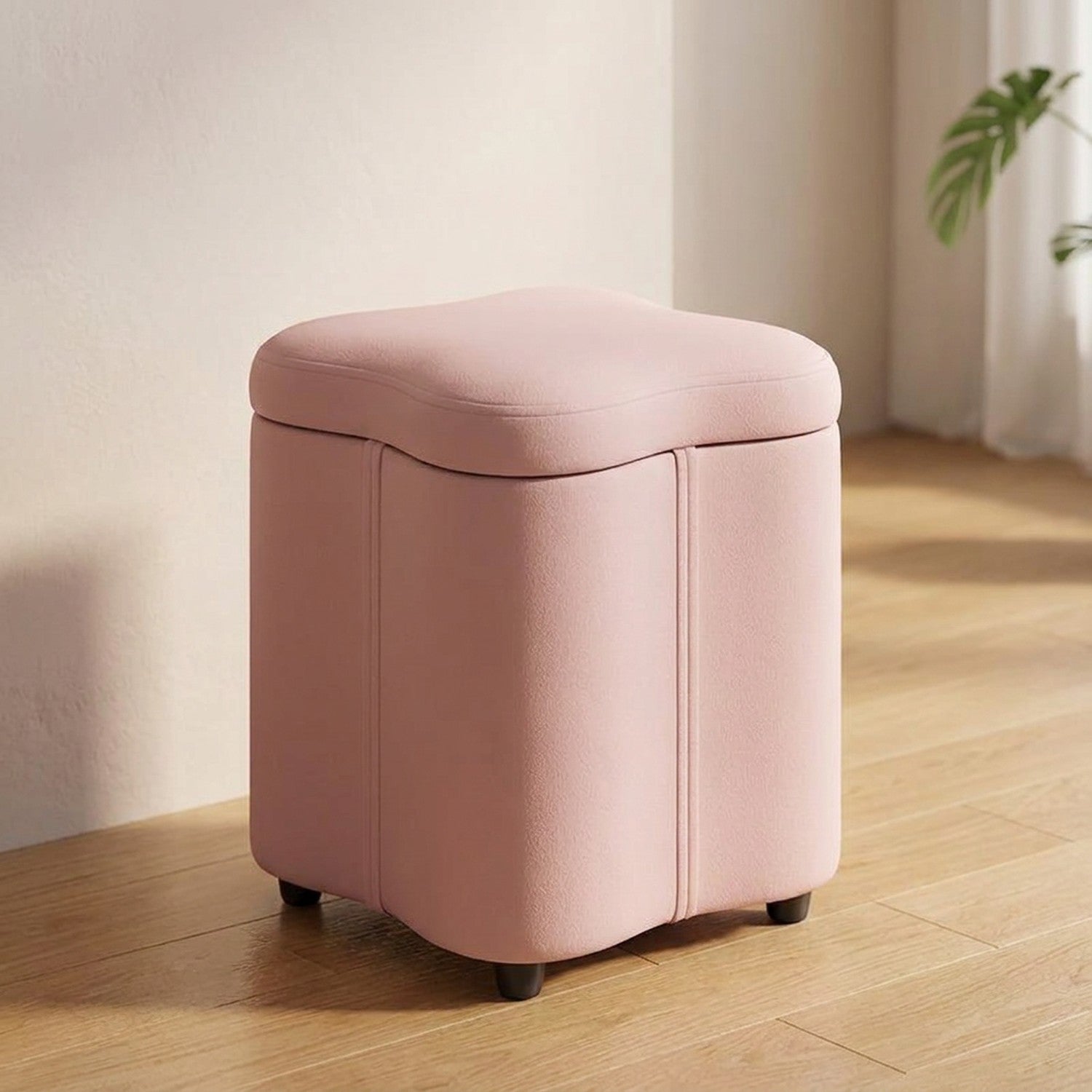 Tabouret coffre de rangement rose poudré à assise rembourrée arrondie