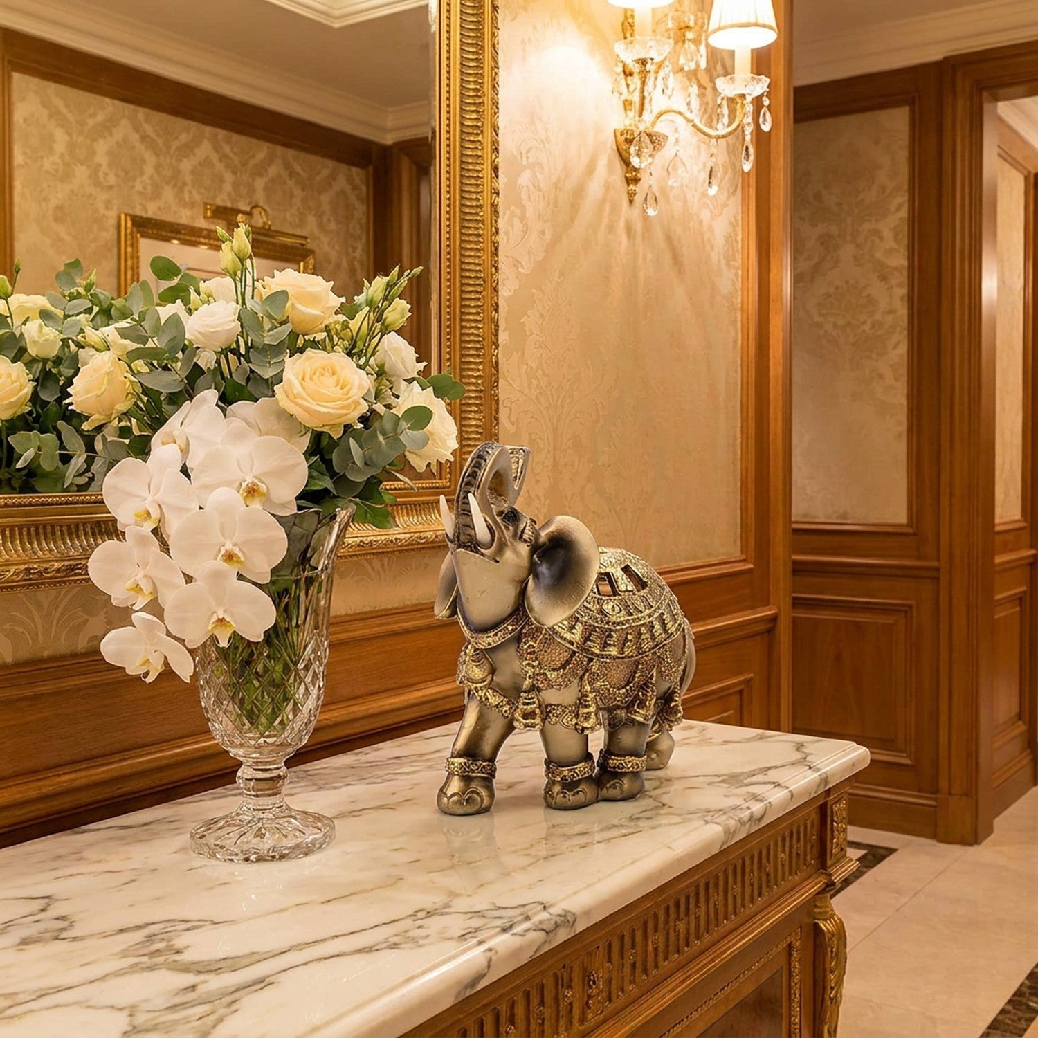 Figurine éléphant doré Feng Shui sur console marbre hall entrée élégant