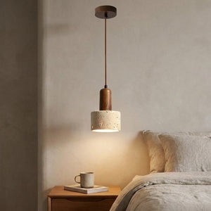 Suspension en travertin au chevet d'un lit dans une chambre épurée
