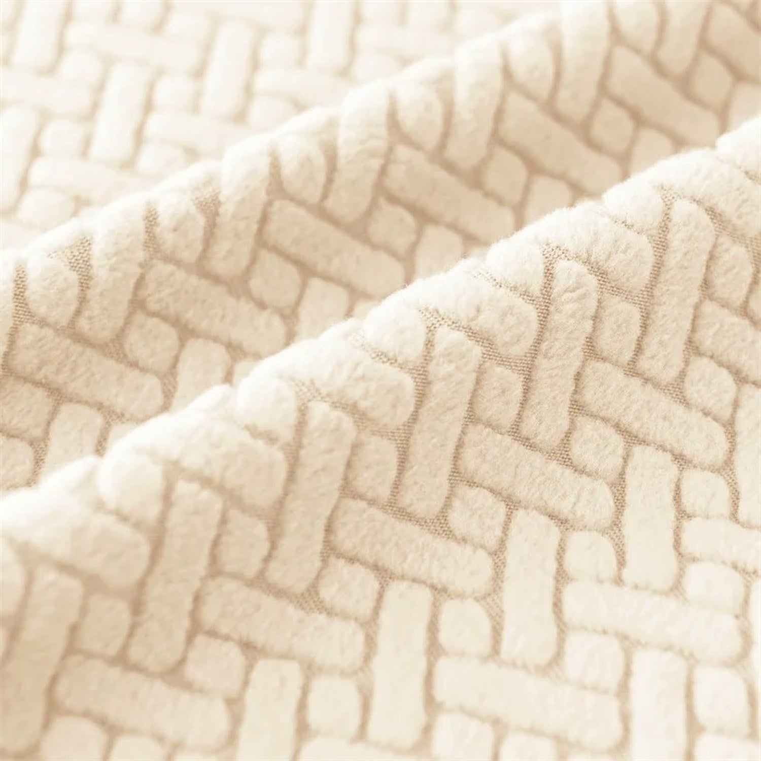 Gros plan du tissu jacquard tissé effet chevrons de la housse de fauteuil