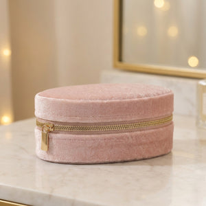 Boîte à bijoux en velours rose au format ovale compact
