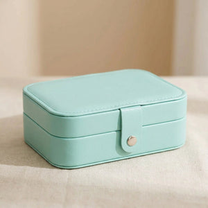 Boîte à bijoux de voyage en simili cuir coloris turquoise