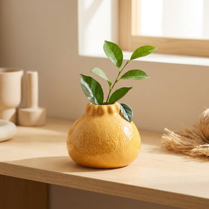 Vase en forme d'orange en céramique coloris jaune doré