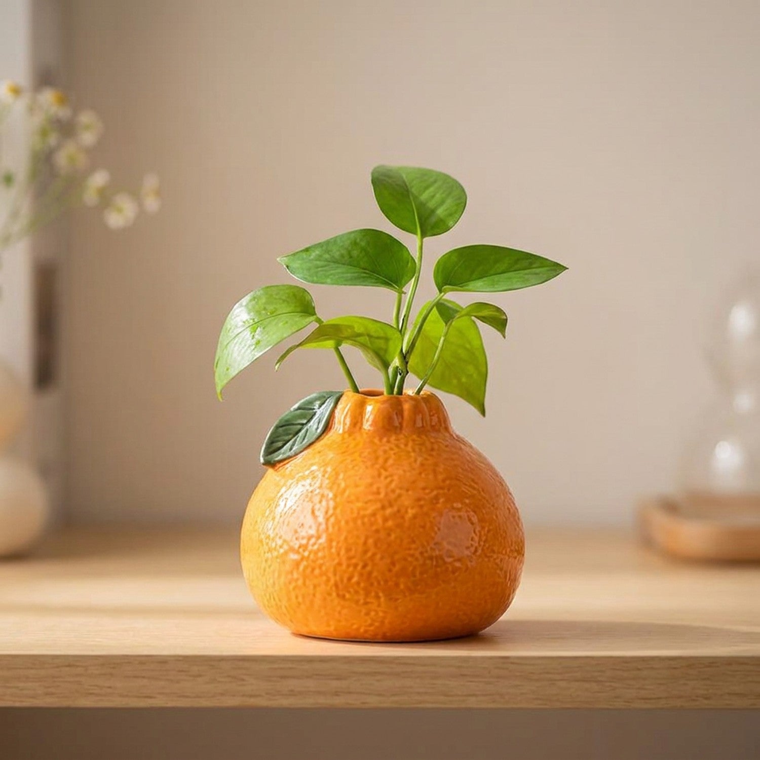Vase en forme d'orange en céramique coloris orange vif