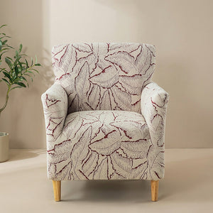 Housse de fauteuil bordeaux à motif de feuilles en jacquard sur un fauteuil club