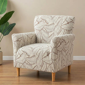 Housse de fauteuil marron à motif de feuilles en jacquard sur un fauteuil club