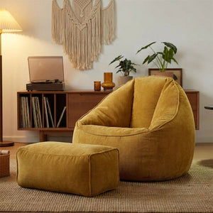 Fauteuil pouf et repose-pieds en velours côtelé doré