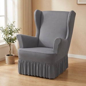 Housse de fauteuil à oreilles grise avec jupe à volants