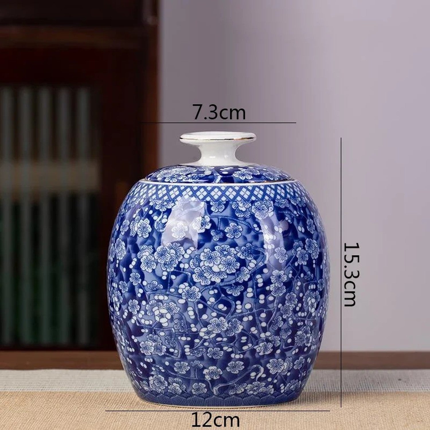 Pot à thé biconique motif prunier porcelaine bleue