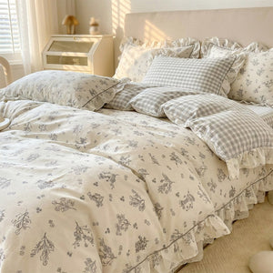 Parure de lit fleurie coloris gris avec motifs botaniques