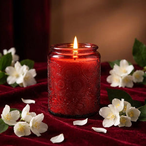 Bougie parfumée Jasmin Nocturne en pot de verre rouge avec fleurs de jasmin blanches