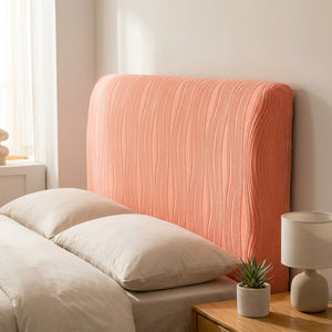 Housse de tête de lit corail en velours jacquard installée sur une tête de lit