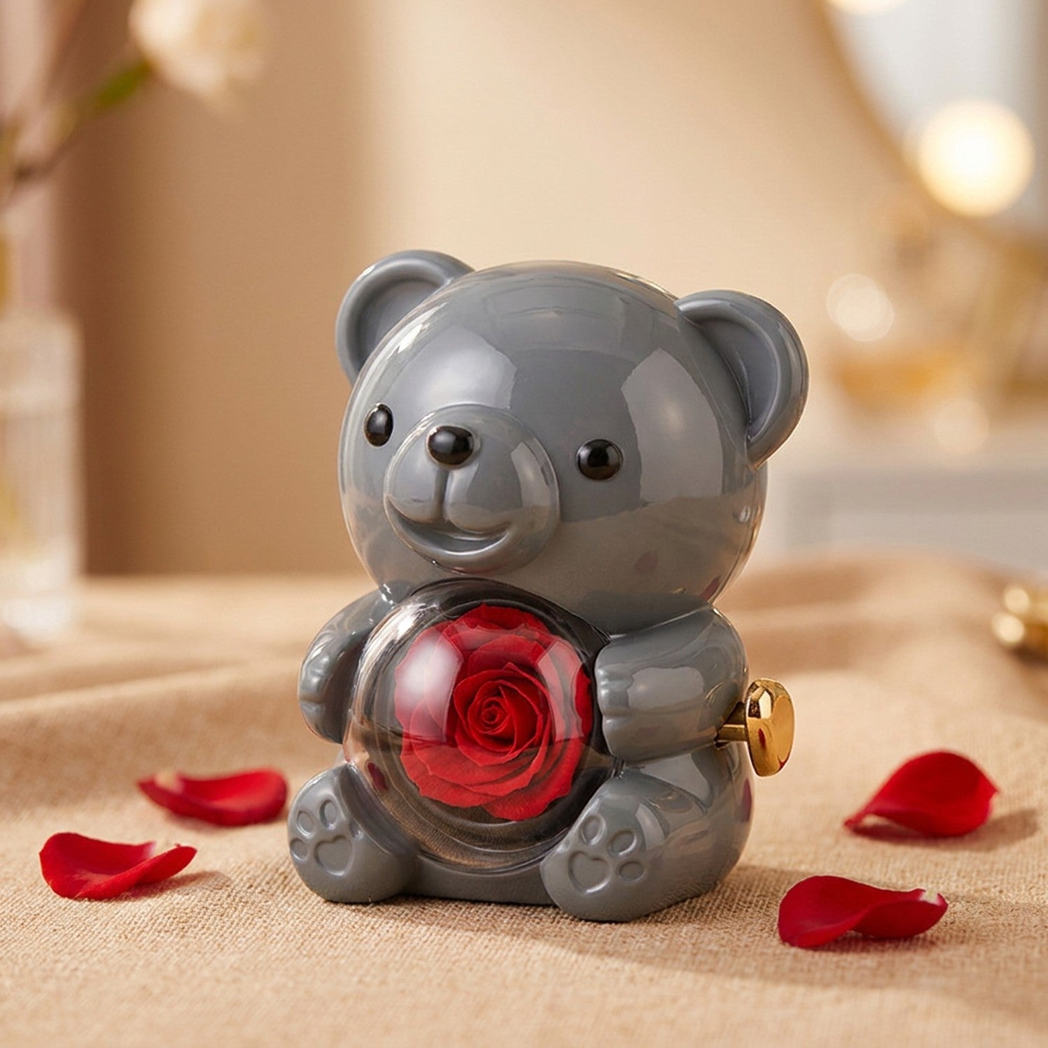 Boîte à bijoux ourson gris avec rose rouge pivotante