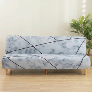 Housse de canapé extensible effet marbre blanc et gris clair sur une banquette sans accoudoirs