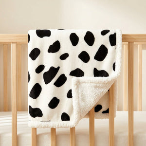 Couverture bébé motif vache noir et blanc avec doublure peluche