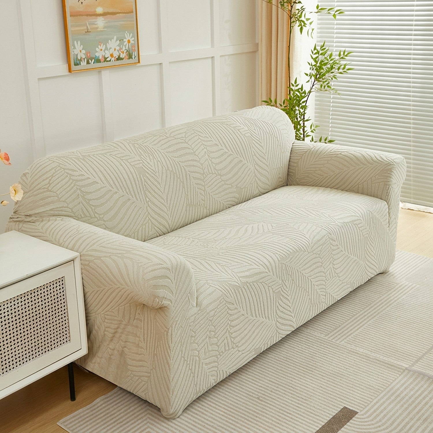 Housse de canapé motif feuilles beige