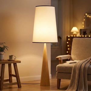 Lampadaire allumé en bois clair avec abat-jour en tissu