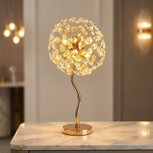 Lampe de table en cristal doré modèle Pied ondulé allumée