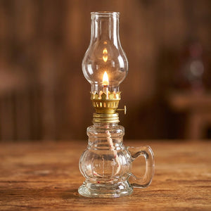 Lampe à pétrole en verre transparent vendue à l'unité allumée