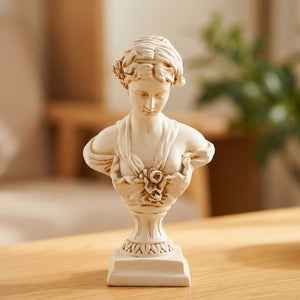 Buste de Vénus en résine finition beige crème sur une table