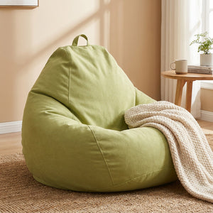 Pouf tatami vert clair en coton doux avec plaid en tricot beige